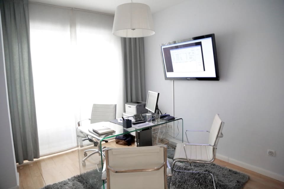 Modern office with light grey walls