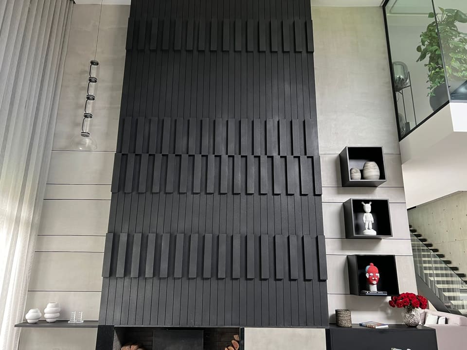 Black 3D wall with decorative niches