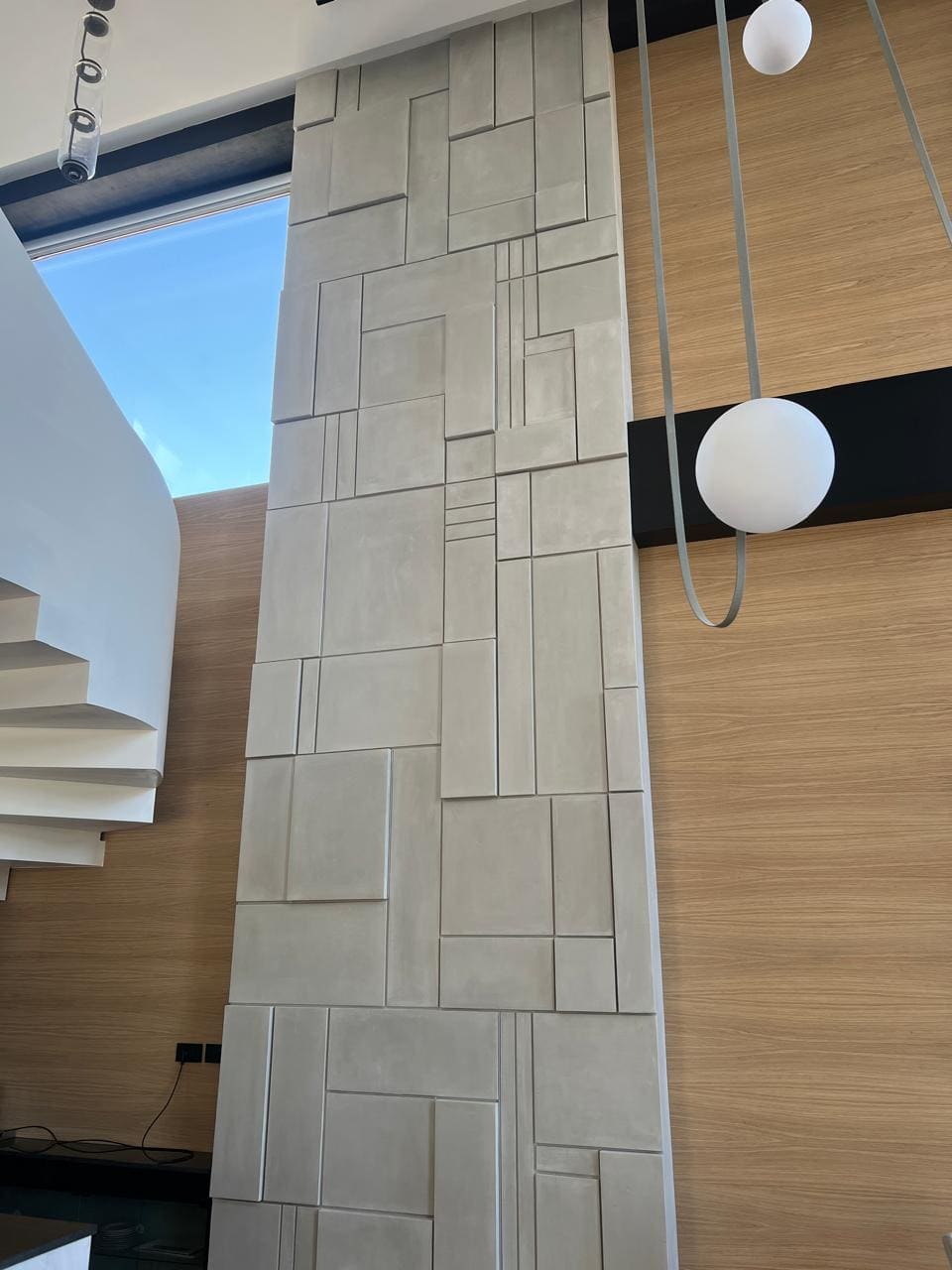 Double-height cut-stone effect wall