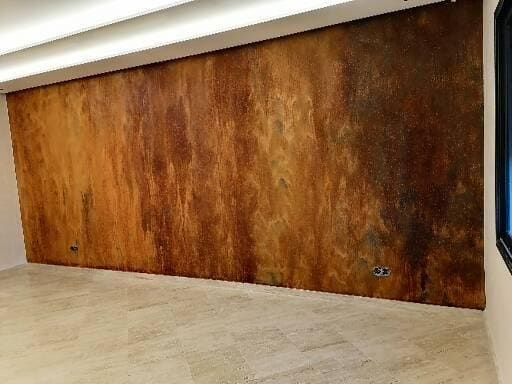 Large wall with rust and oxidised-metal finish